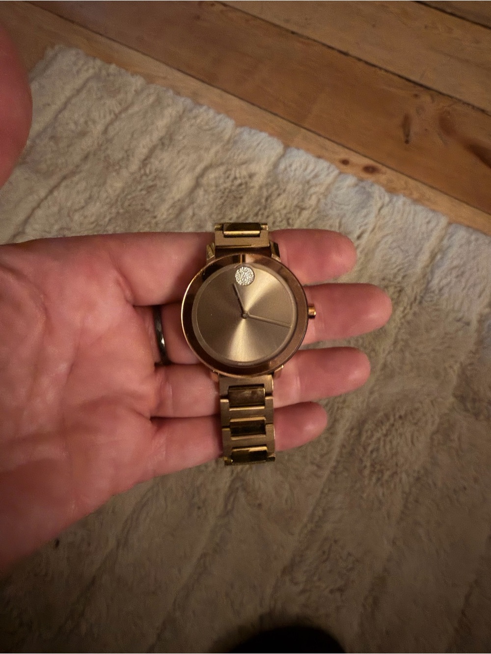 Movado Rose Gold Minimalist Bracelet Watch with a diamond